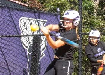 softball player hitting the ball